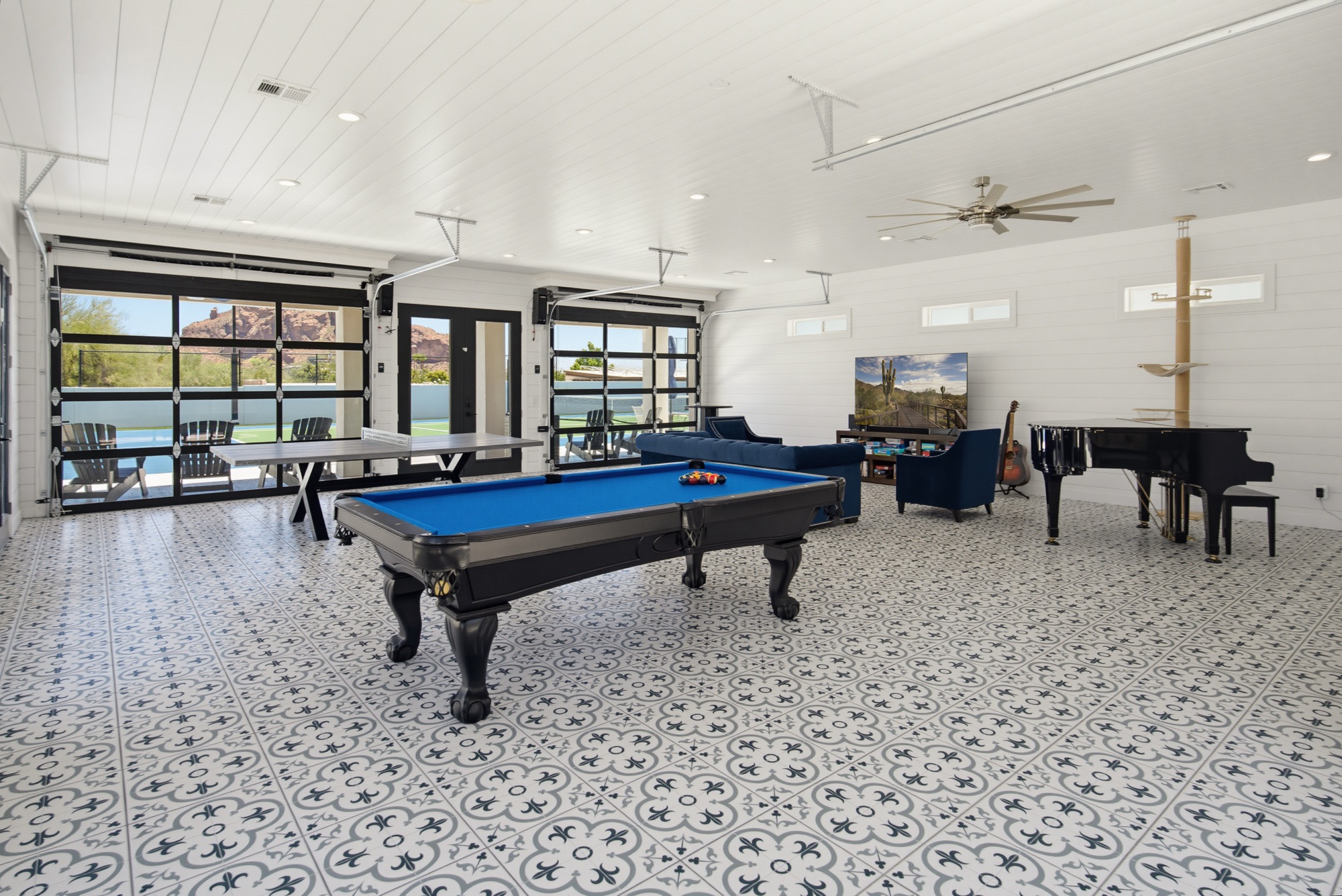 Games pavilion with pool table and grand piano