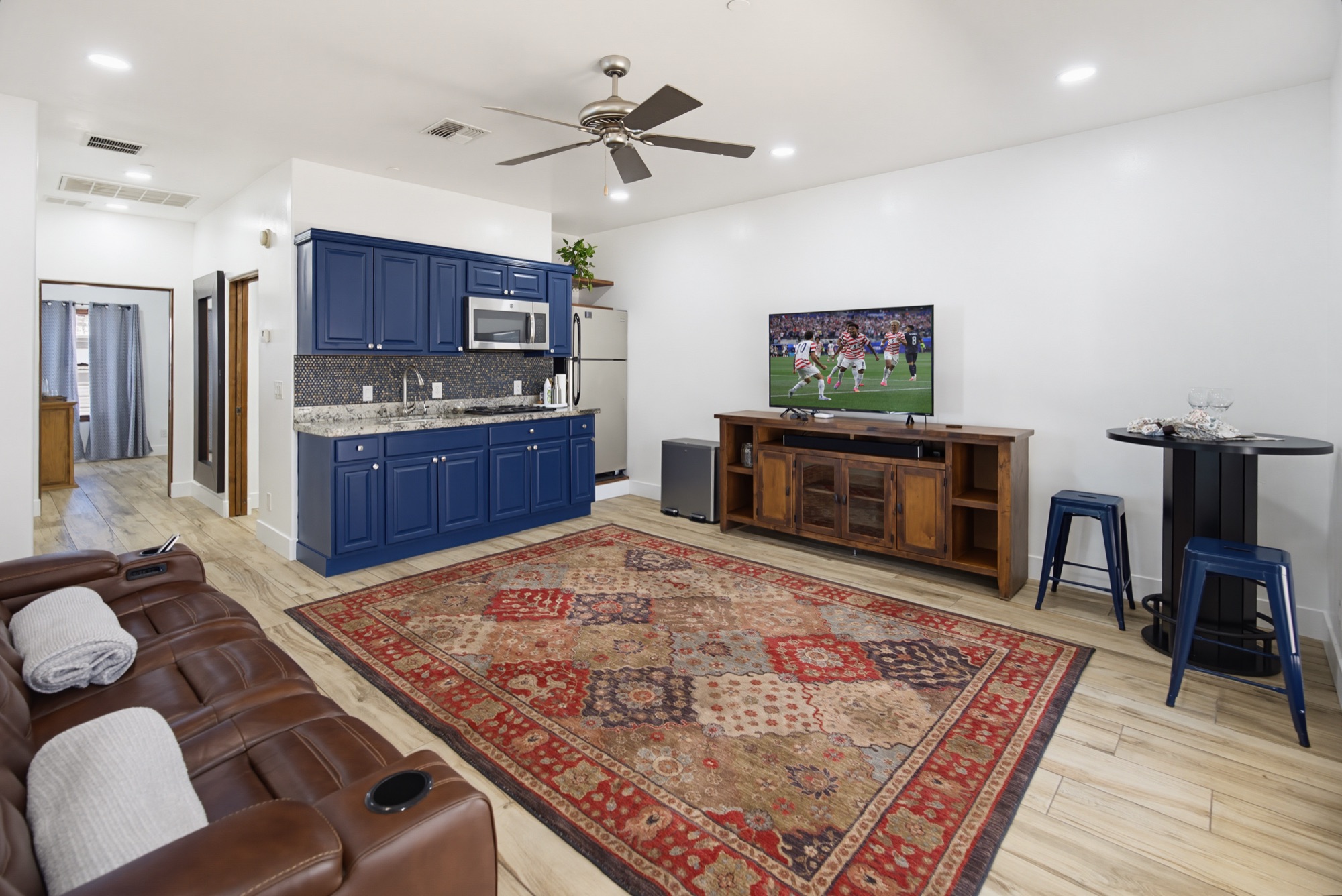 Guest house lounge with kitchenette and theater seating
